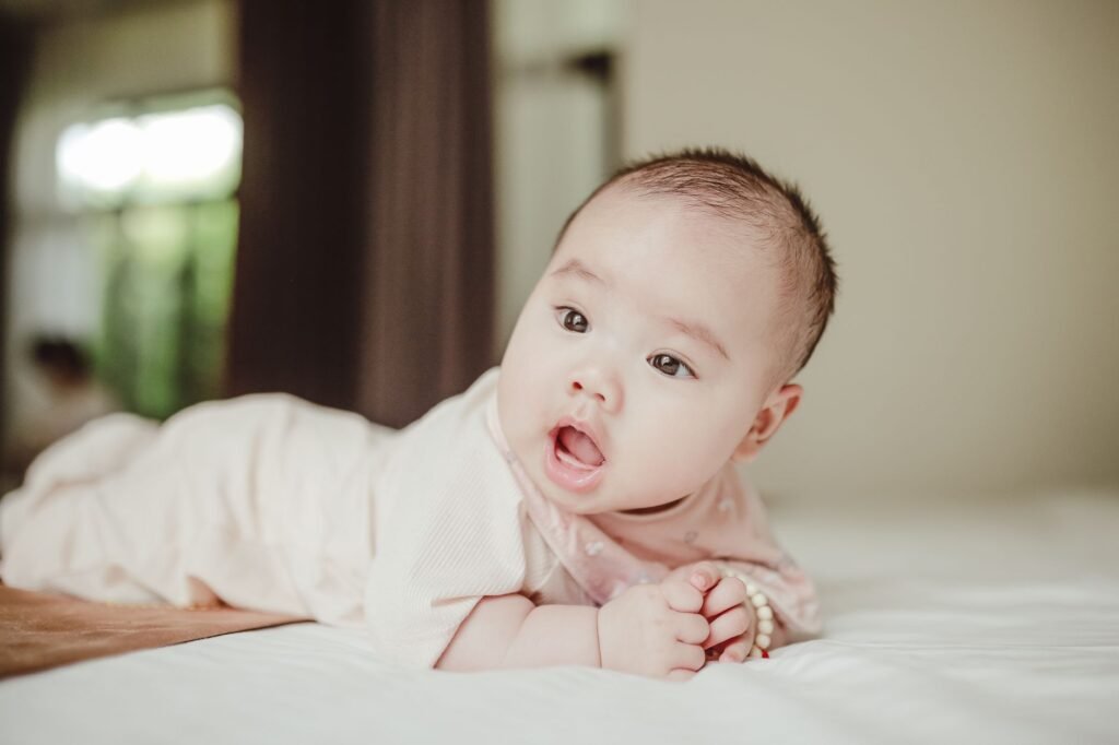 A baby lifting their head during supervised tummy time