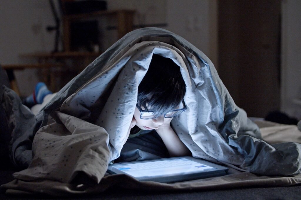 A blanket fort or living room campout can turn an ordinary movie into an event