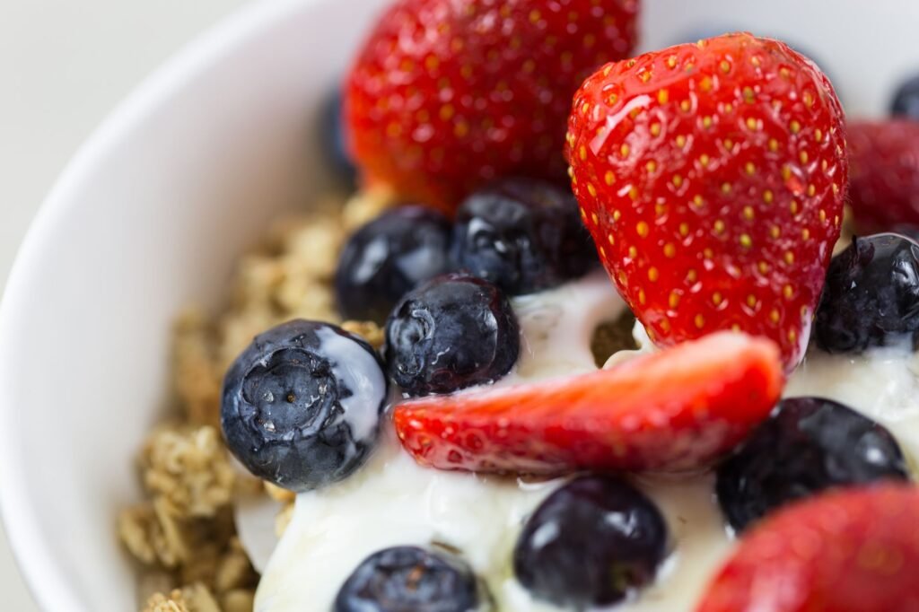 A colorful, balanced breakfast bowl with fruit and whole grains