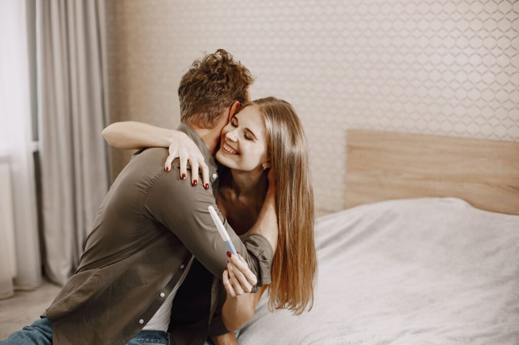 A couple joyfully embracing after discovering they are expecting