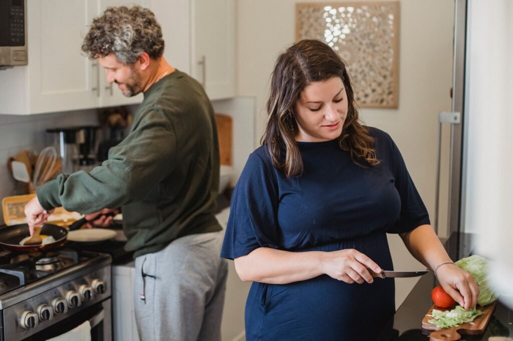 A couple preparing a healthy meal together, emphasizing the importance of nutrition