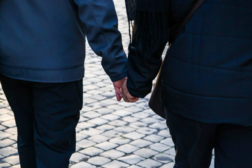 A couple taking a relaxed walk outdoors together