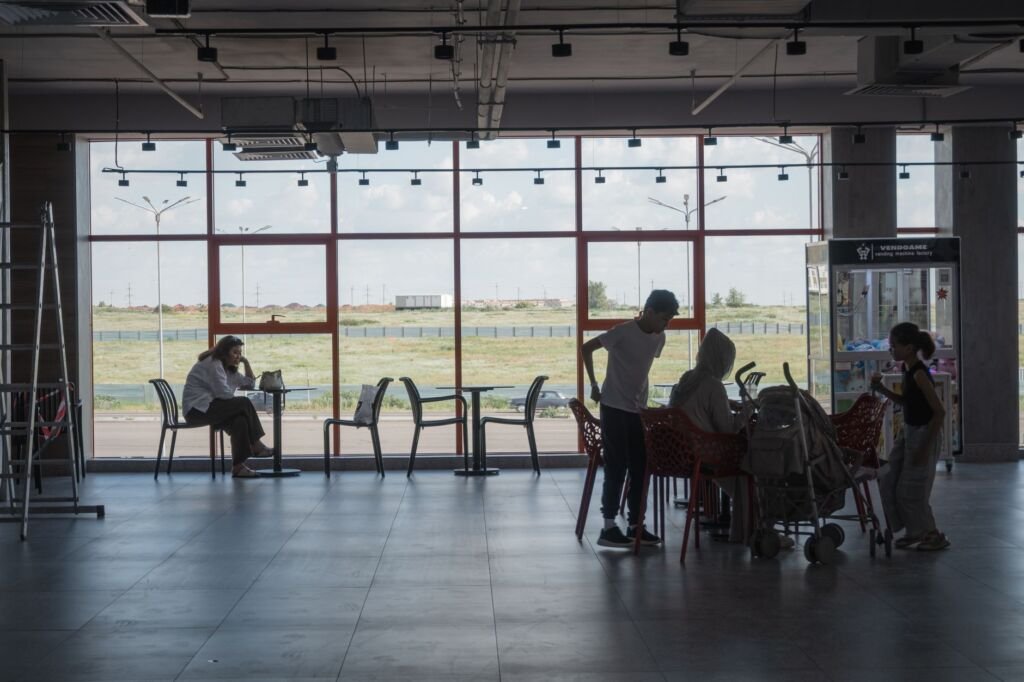 A family enjoying their time at the airport together before their flight