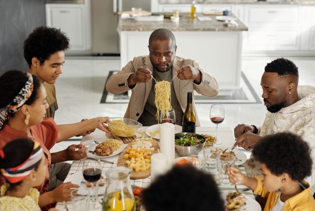 A family sharing a relaxed dinner at the table