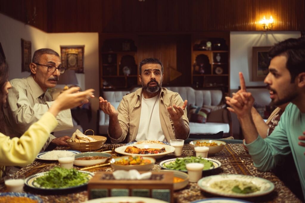 A family sitting together at the table, sharing a meal and bonding