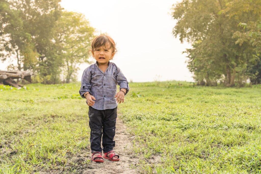 A happy toddler boy exploring outdoors