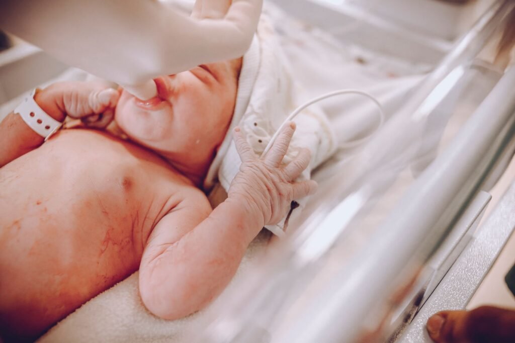 A newborn baby wrapped in a blanket shortly after birth