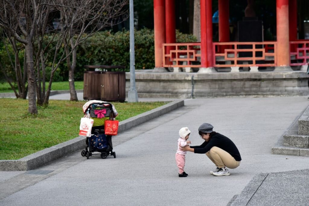 A parent comforting their child during a public outing