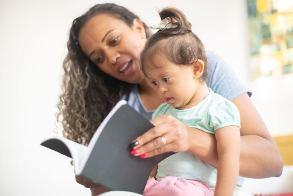 A parent reading a picture book with a young child