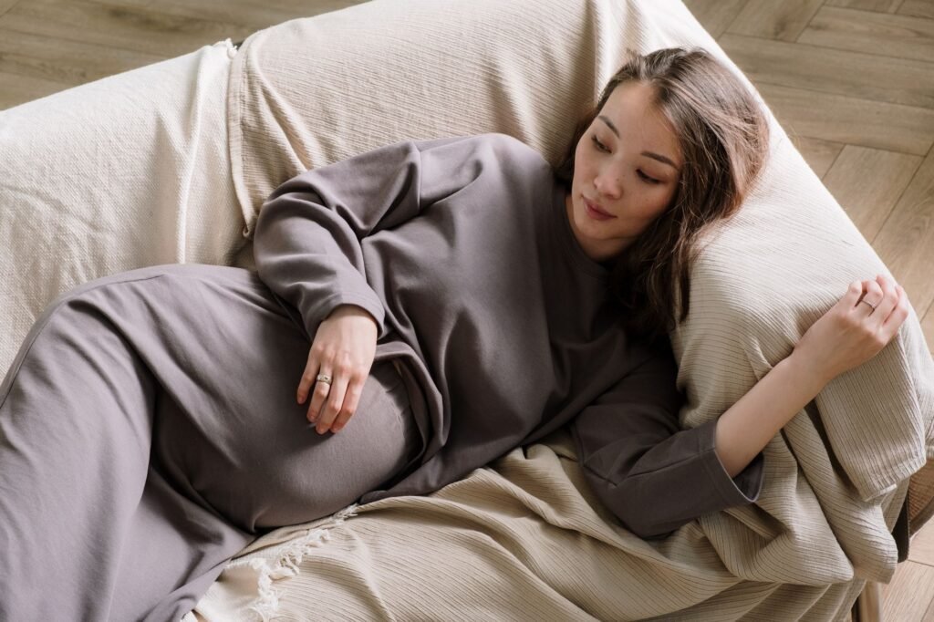 A pregnant woman resting comfortably at home in late pregnancy