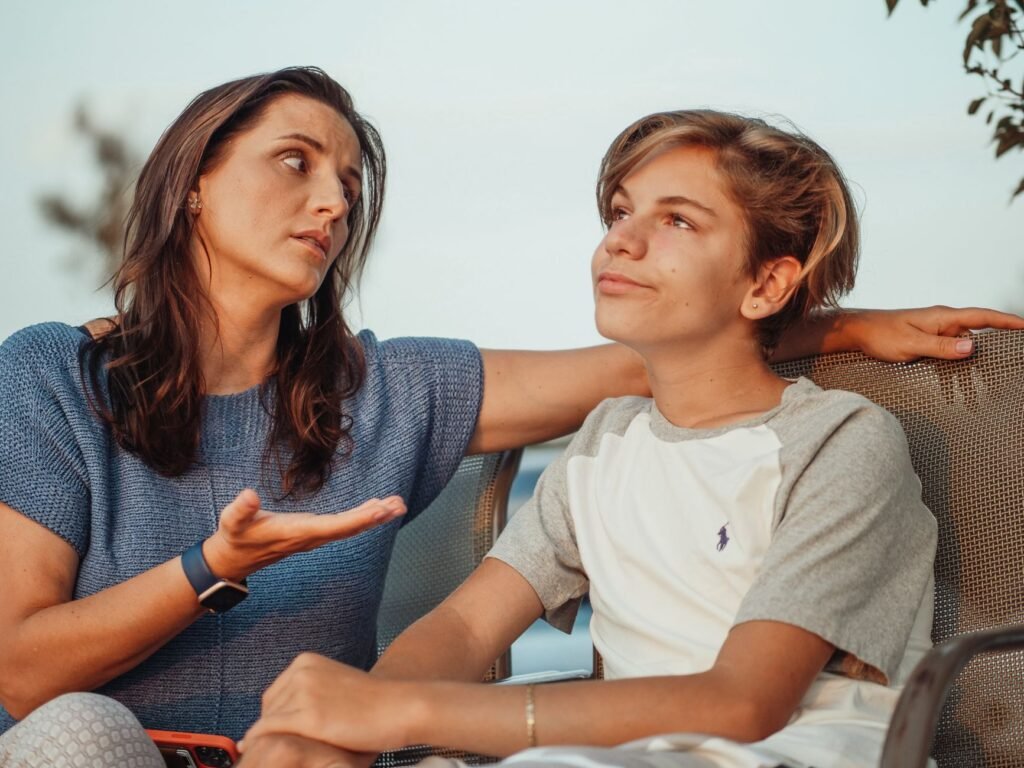 A teenager and parent having a relaxed conversation
