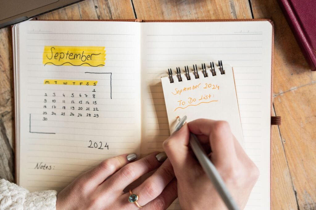 A woman noting her cycle details in a planner to track ovulation