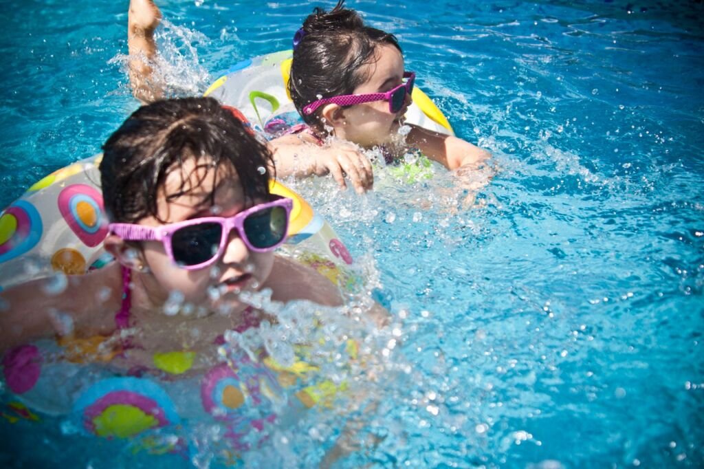 Children engaging in fun, supervised play at the pool