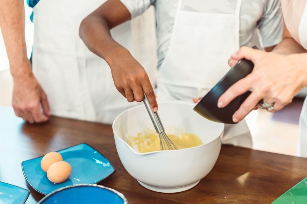 Engaging toddlers in cooking tasks fosters their motor skills and confidence in the kitchen