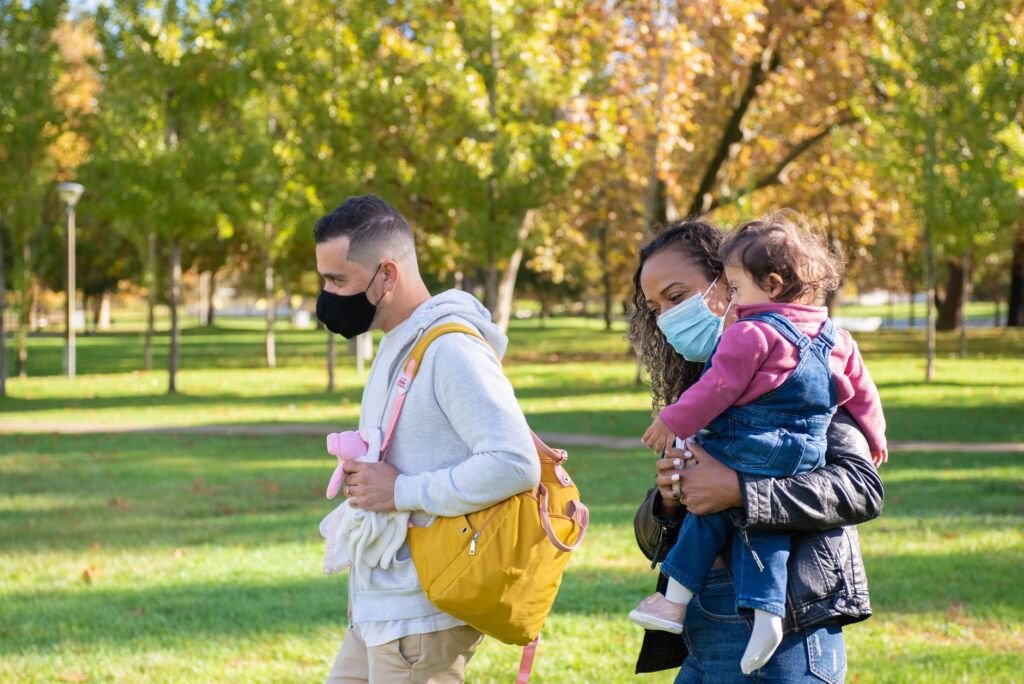 A baby comfortably nestled in a carrier while exploring the outdoors