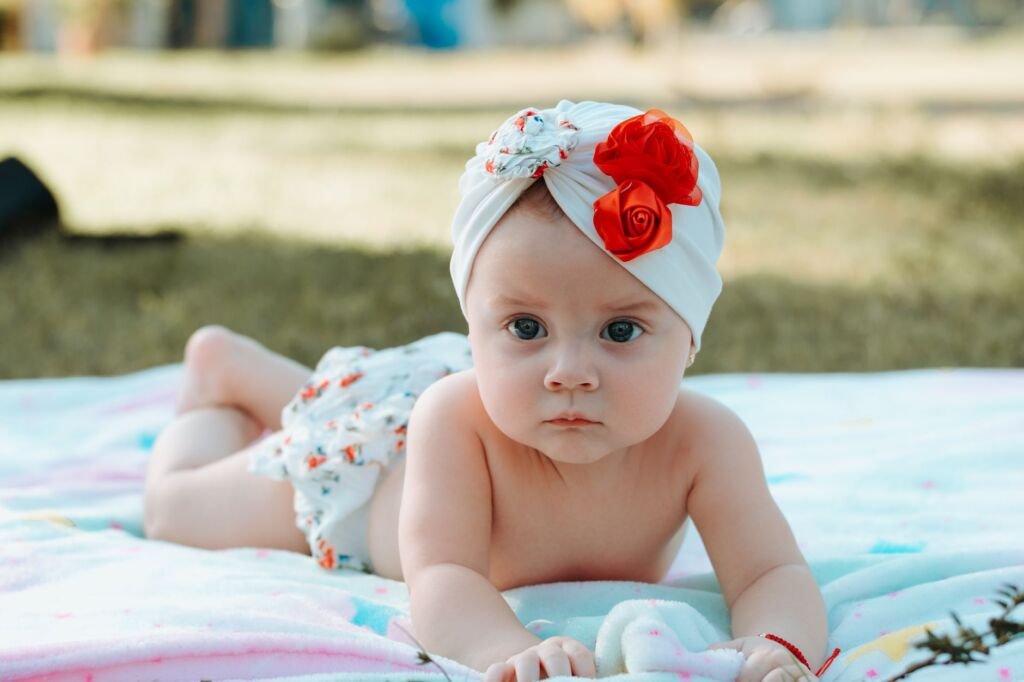 A baby joyfully playing in a garden, surrounded by nature