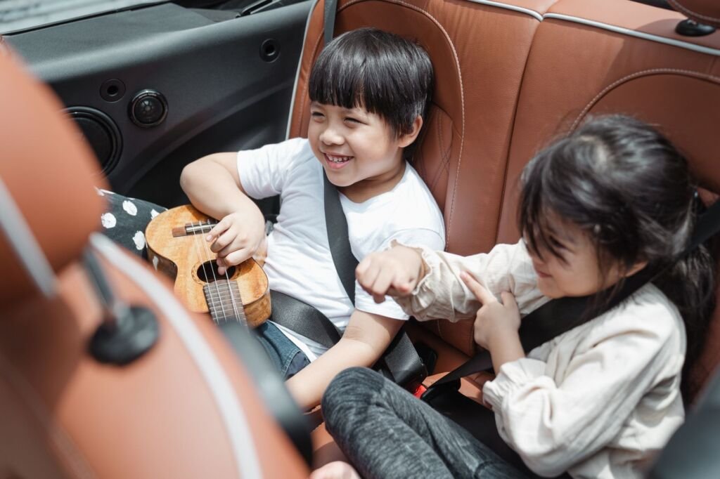 A child comfortably seated in a convertible car seat, ready for an adventure