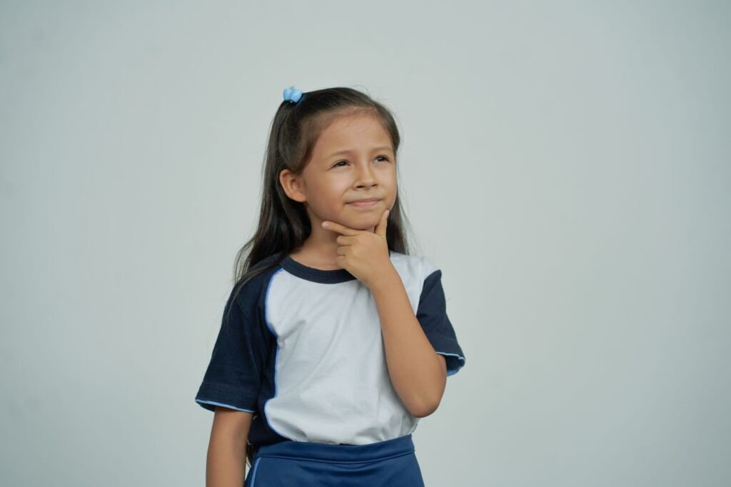 A child curiously asking questions during a family discussion