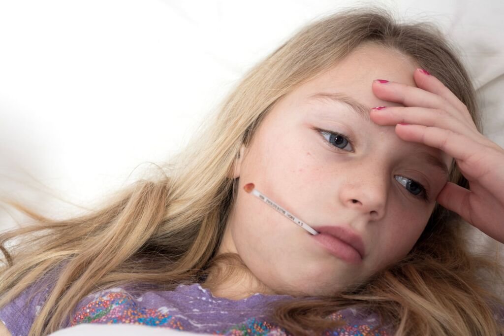 A child showing signs of illness, such as a fever