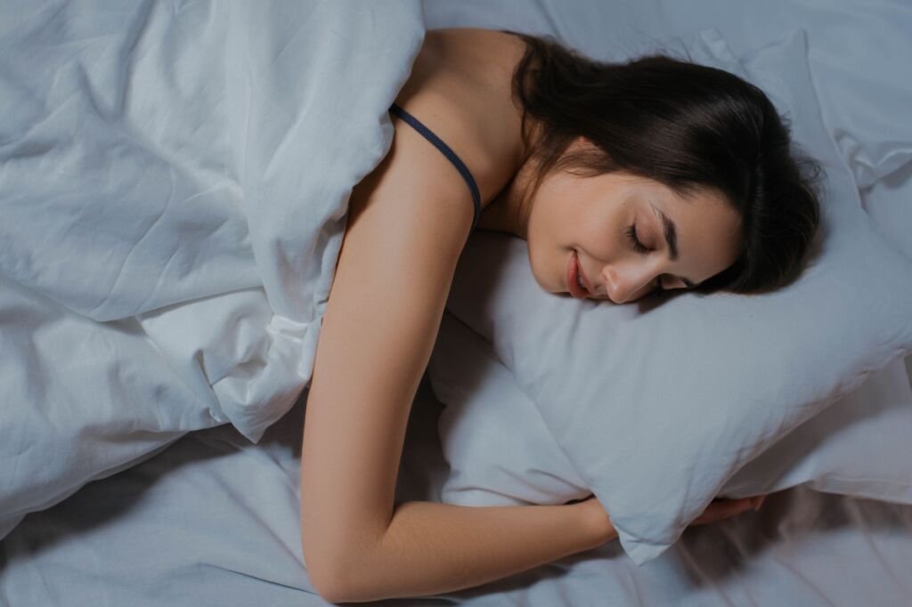 A child sleeping peacefully in their bed, showcasing a comforting sleep environment