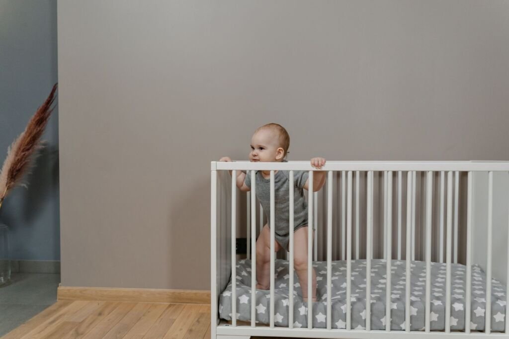 A close-up of a crib showcasing its safety features and firm mattress