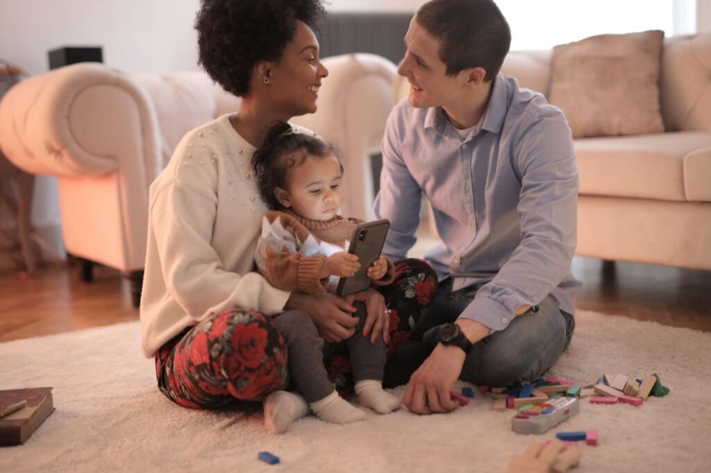A family discussing where babies come from in a comfortable setting