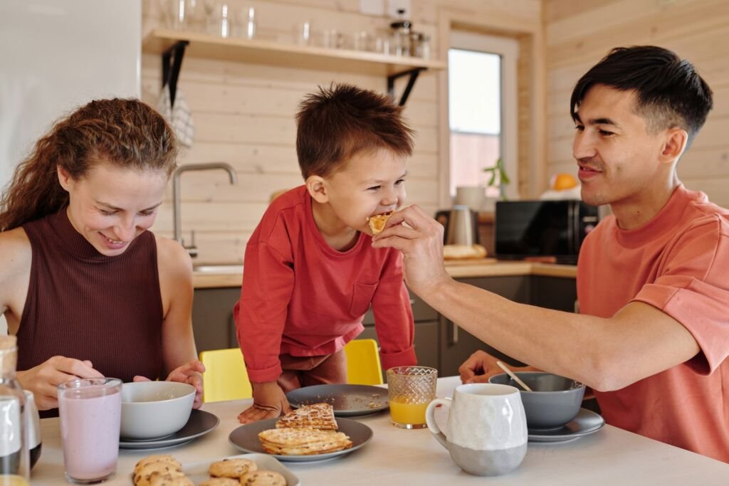 A family enjoying breakfast together at the table