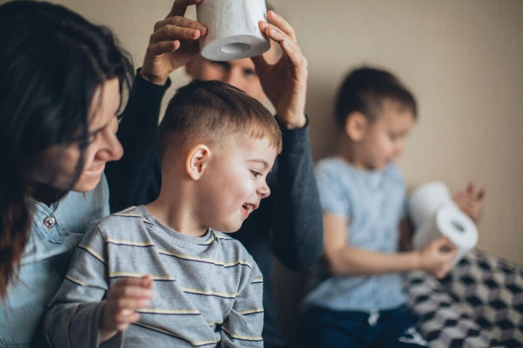 A joyful child sitting on the toilet, celebrating a potty training success