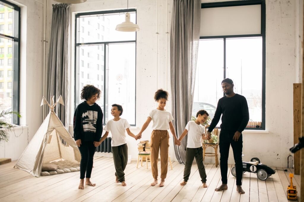 A joyful family preparing for adoption in their cozy living room