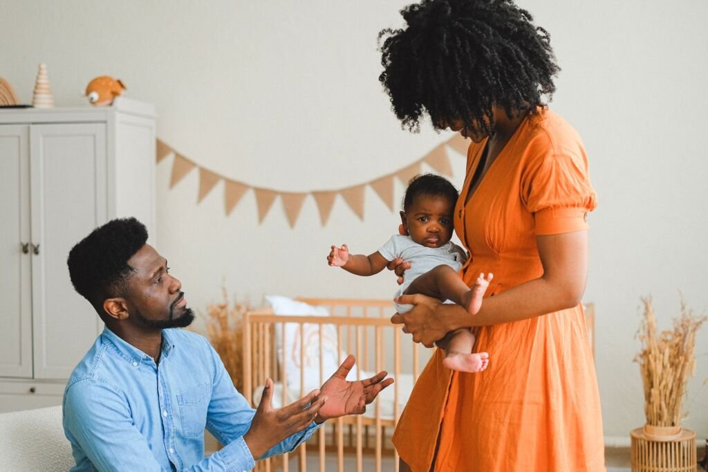 A loving family moment with parents and baby at home, embracing warmth and togetherness