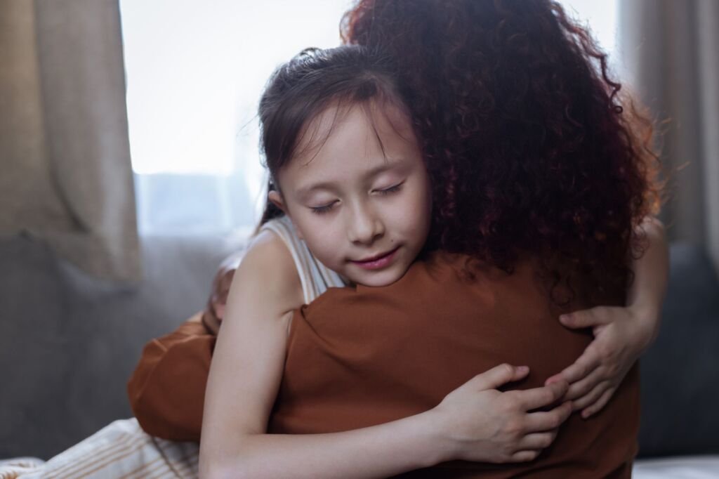 A parent comforting their child, a vital part of managing tantrums effectively