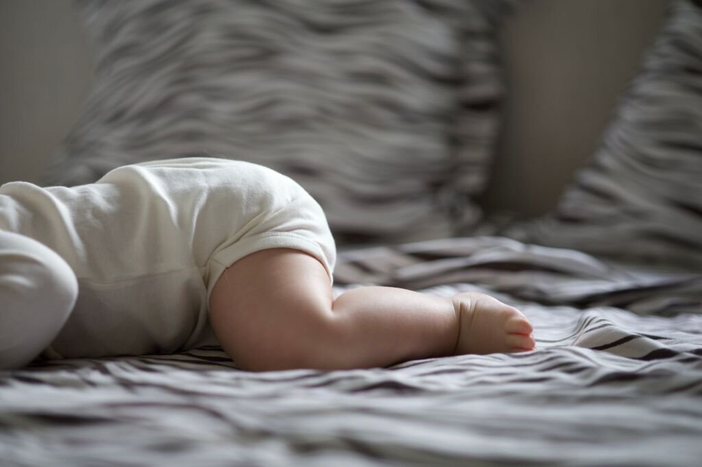 A safe sleeping environment for infants, emphasizing the importance of safety in development