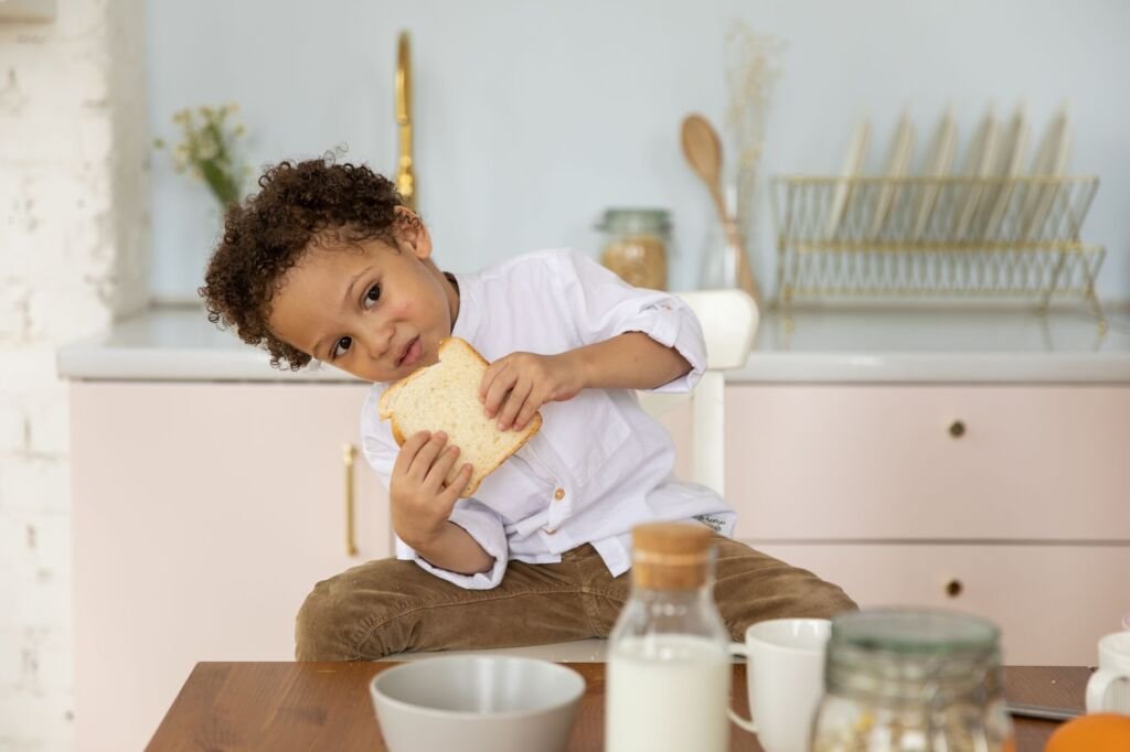 A toddler happily enjoying a colorful, healthy snack