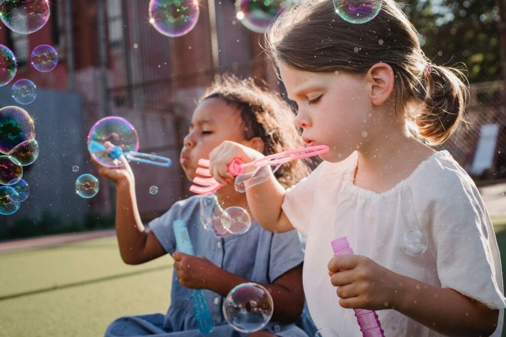 Children playing together at a park, enjoying their time and building friendships