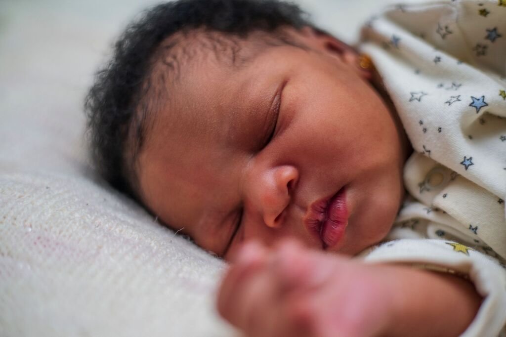 Close-up of a peaceful and adorable sleeping baby showcasing innocence and tranquility
