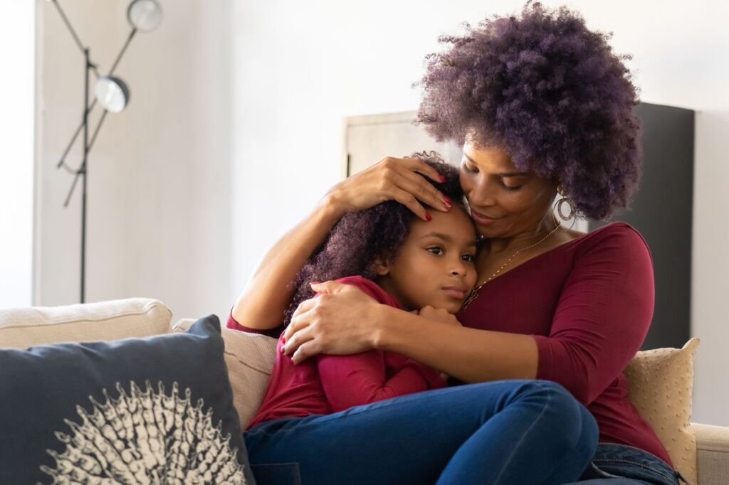 Comforting a child during tough moments builds trust and emotional safety