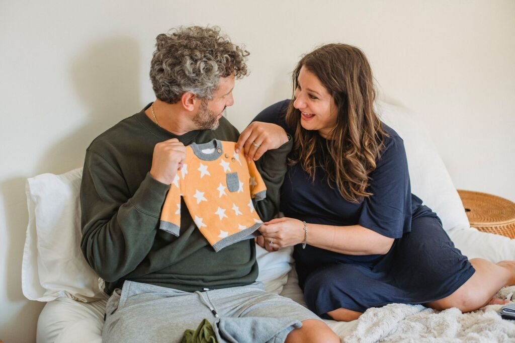 Expecting parents discussing their pregnancy journey together