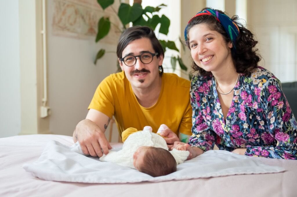 Loving parents holding their newborn baby girl, celebrating her unique name