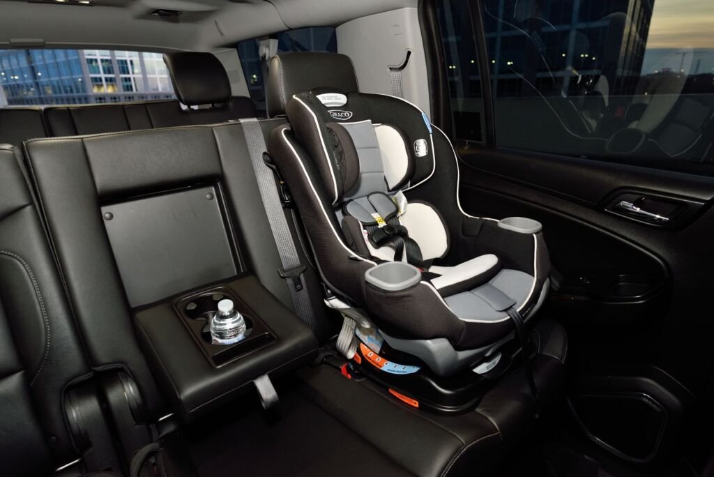 Safety car seat securely installed in the back of a modern vehicle